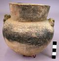 Ceramic, complete jar, round bottom, fire blackened, applied shoulder effigies