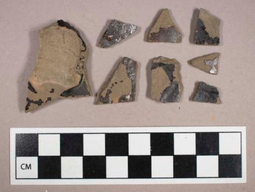 Ceramic, earthenware, black glazed buckley-type body and base sherds