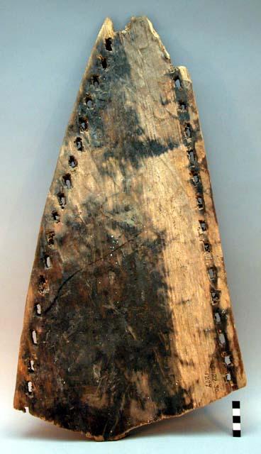 Fragment of side board of 3 plank canoe - old specimen, shaped by fire+