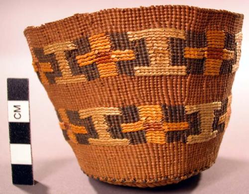 Basket, woven grass, rounded base, cylindrical, polychrome geom. design