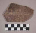 Potsherd - black and white decoration on face