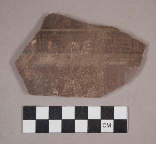 Potsherd - black and white decoration on face