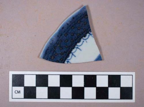 Ceramic, porcelain, English/French(?), blue and white decoration, rim sherd