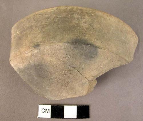 Rim potsherd-2 holes through sherd near rim