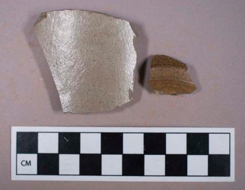 Ceramic, stoneware, grey bodied, brown interior slip, body sherds