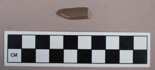 Ceramic, redware, unglazed, brown slip, rim sherd