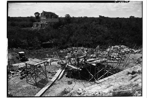 Caracol. Trench at base of upper stairway showing poles placed to prevent walls