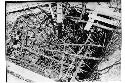 Caracol. Trench at base of upper stairway showing poles placed to prevent walls