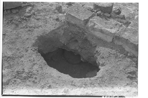 Olla under masonry block at Caracol