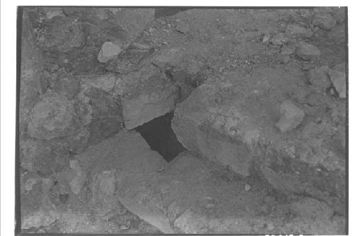 Olla under masonry block at Caracol