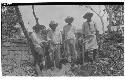 Laborers standing along upper terrace