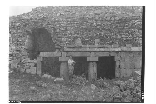 Woman standing in temple doorway, Structure 2C3; Room 2