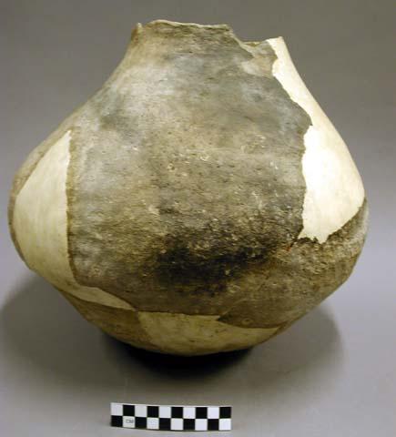 Fragment of pot, restorable. coarse, rough.