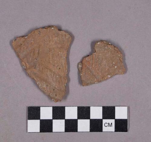 Ceramic, earthenware body sherds, shell-tempered, cord-impressed and incised