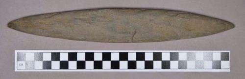 Ground stone, modified lithic, oblong shaped with tapered ends