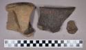 Ceramic, earthenware rim and body sherds, shell-tempered, incised, punctate, cord-impressed, and undecorated, strap handles