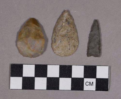 Chipped stone, scrapers and one triangular projectile point