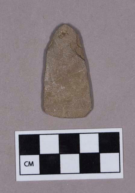 Ground stone, triangular shaped, pointed implement