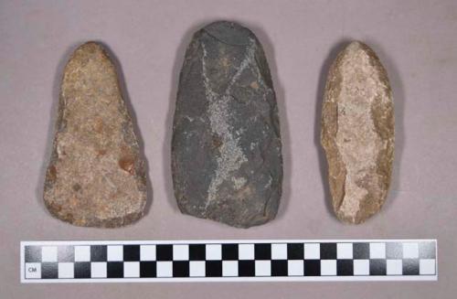 Ground stone axe, chipped stone adze, and a modified lithic, oblong cobble with pecked edges