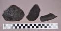 Ground stone, modified coal fragments