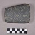 Ground stone fragment, possible base of tool