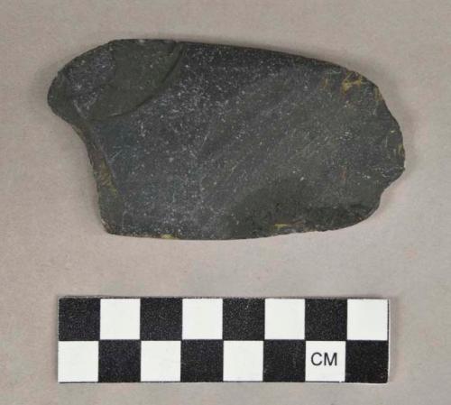 Ground stone fragment, flat and ovoid