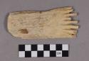 Organic, antler comb, eight fragmented prongs