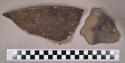 Ceramic, earthenware rim and body sherds, shell-tempered, cord-impressed, punctate, notched rims, and undecorated, strap handle