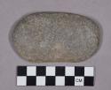 Ground stone, modified lithic, oval-shaped cobble with chipped and worn edge