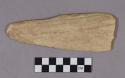 Organic, utilized antler, triangular shaped with sharpened blade