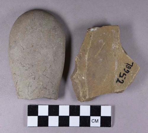 Ground stone, grooved abrading stone fragment and one rounded, modified lithic fragment