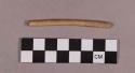 Organic, utilized bone fragment, rod-shaped object with flattened tip