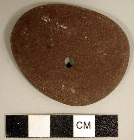 Ground stone, flat, ovoid stone, perforated