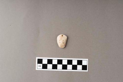 Ground stone; ornament; pendant; incised, both sides