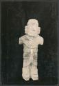 Carved stone human figure