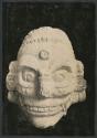 Carved stone head of Tlaloc