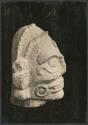 Carved stone head of Tlaloc, side