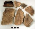 Ceramic, earthenware body and rim sherds, some cord-impressed, some cord-impressed and incised, some incised, some with incised rim, some with possible handle attachments, one perforated near rim, shell-tempered; two body sherds crossmend, two rim sherds crossmend, one rim sherd and three body sherds crossmend