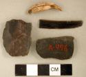 Chipped stone, biface fragments and prismatic blade; perforated animal tooth