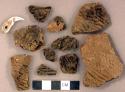 Coarse earthenware body sherds, cord impressed; perforated animal tooth