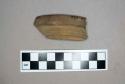 Ceramic, redware rim sherd, dark brown glaze interior, undecorated exterior