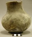 Ceramic jar, plain interior and exterior, straight neck, rim sherds missing
