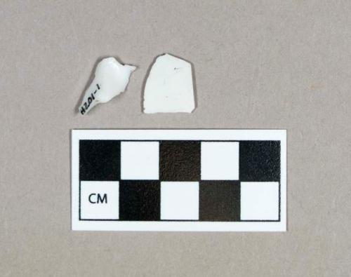 Glass, curved milk glass fragments