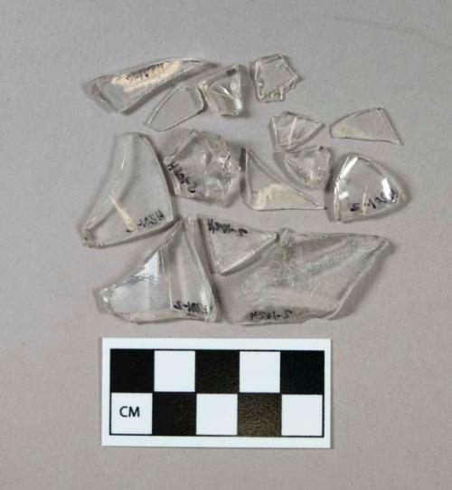 Glass, clear curved glass fragments