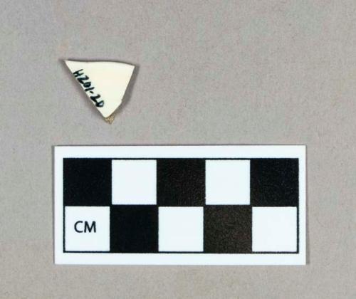 Ceramic, scalloped creamware rim sherd