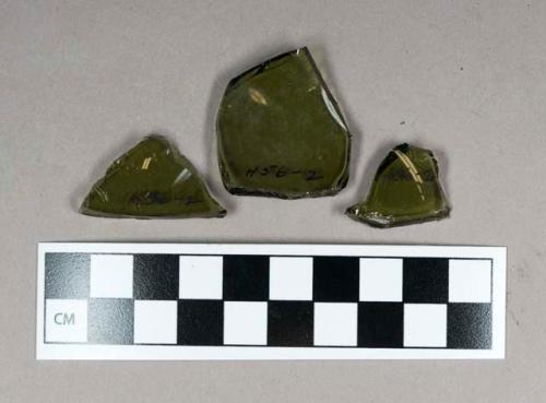 Glass, curved olive green body fragments