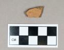 Ceramic, clear-glazed redware body sherd