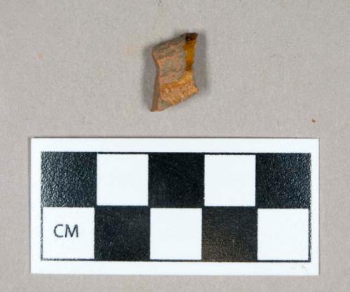 Ceramic, redware rim sherd, clear glaze interior and exterior