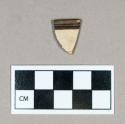 Ceramic, white salt glazed stoneware rim sherd, brown band encompassing lip interior and exterior