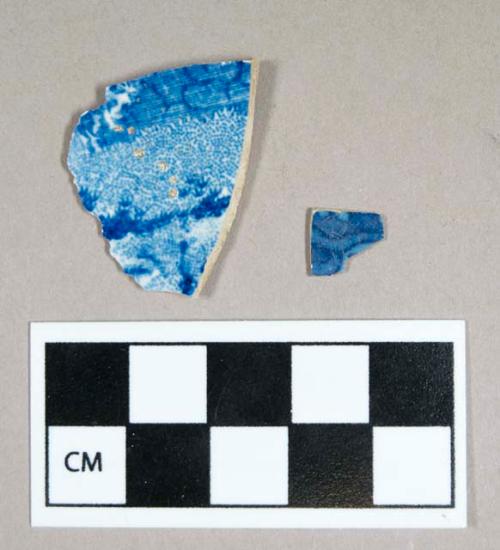 Ceramic, white/buff-bodied refined earthenware body sherds, blue transfer print interior, exterior surface missing